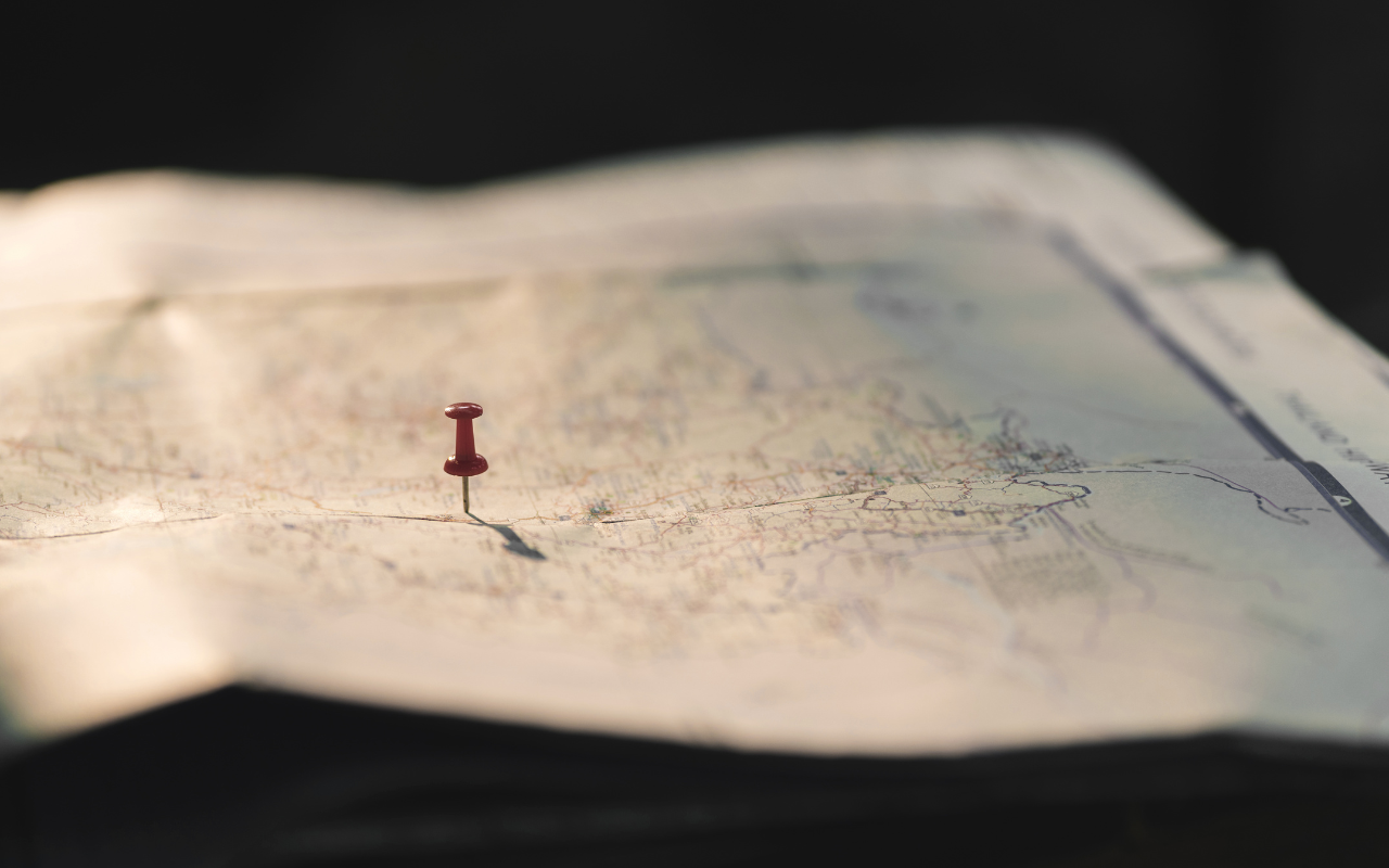 Illustration of a compliance roadmap showing GDPR, CCPA, SOC 2, and ISO 27001 icons connected by pathways representing global privacy and security regulations.